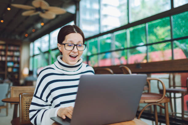 istock Young woman working and video conferencing with colleagues, looking surprised 1488784685