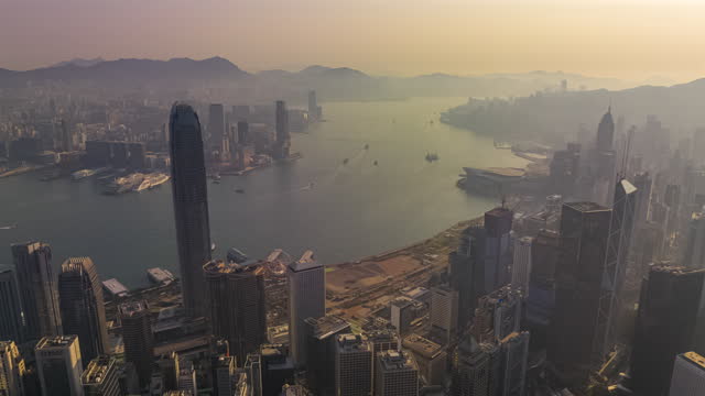 Hyperlapse Hong Kong cityscape in sunrise with fog