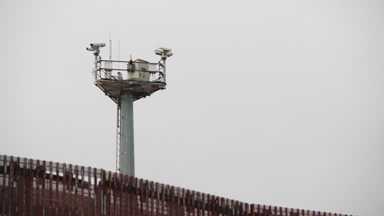 A Security Camera Tower at the US-Mexico Border Wall, Watching for Immigrants Crossing at the Tijuana - San Diego / Mexico - United States Border in Tijuana Mexico