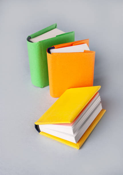 istock mini books in colored covers on a gray background 1488787145