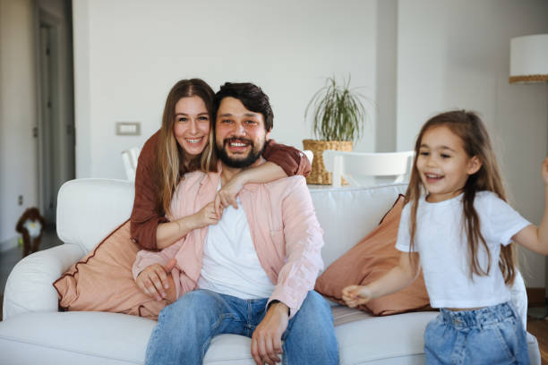 istock Happy young family at home 1488787553