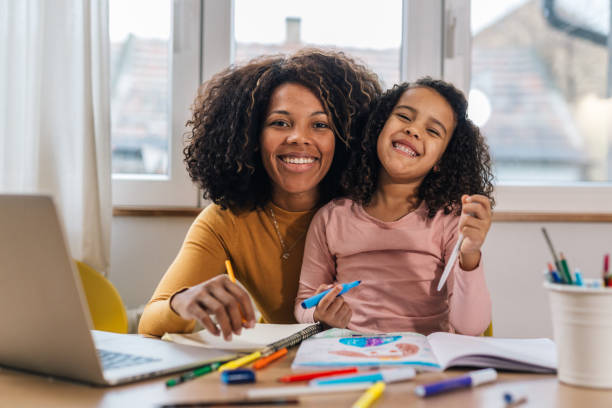 istock mother and daughter at home 1488789271