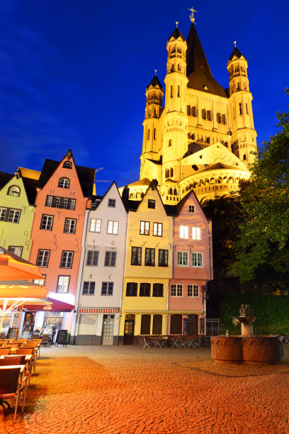 Colorful houses with the Great St. Martin Church in the background in Cologne, Germany