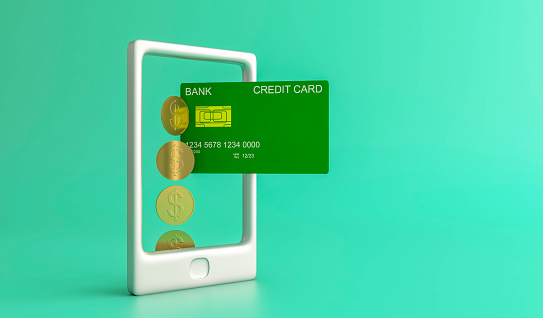 Online payment concept with mobile phone and credit card.