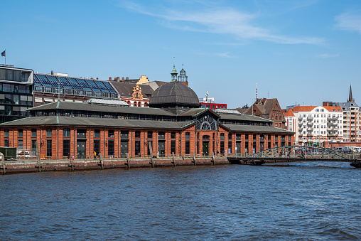 Hamburg, Germany - 04 17 2023: View of the fish auction hall in Hamburg Altona from the water.