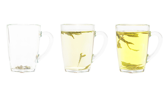 Transparent tea cup. Isolated on a white background. Dragon Well green tea (Longjing tea).