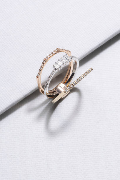 istock Ring made of white gold decorated with precious stones on a white background. 1488800157