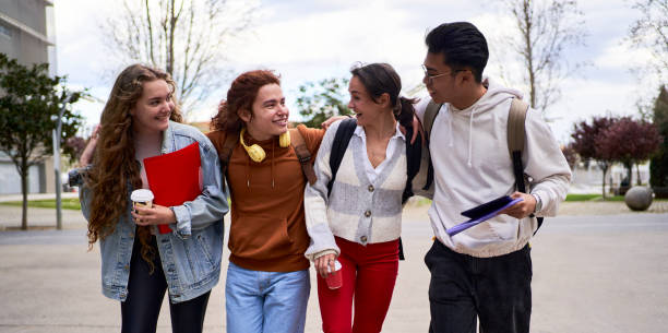 istock Diverse group of students walking outside the university, talking and having fun. 1488809419