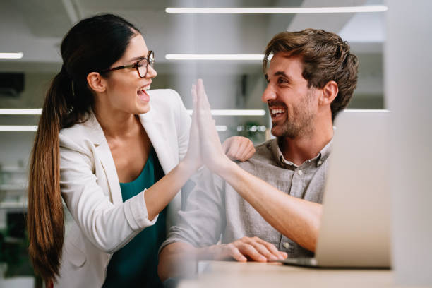 istock Smiling diverse colleagues gather in boardroom brainstorm discuss financial statistics together 1488809490
