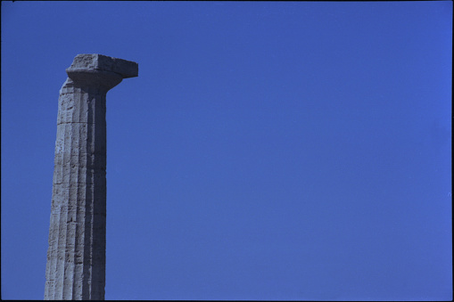 Close up of old pillars against blue sky