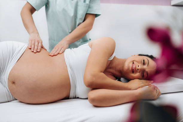istock Pregnant woman at relaxing massage 1488811671