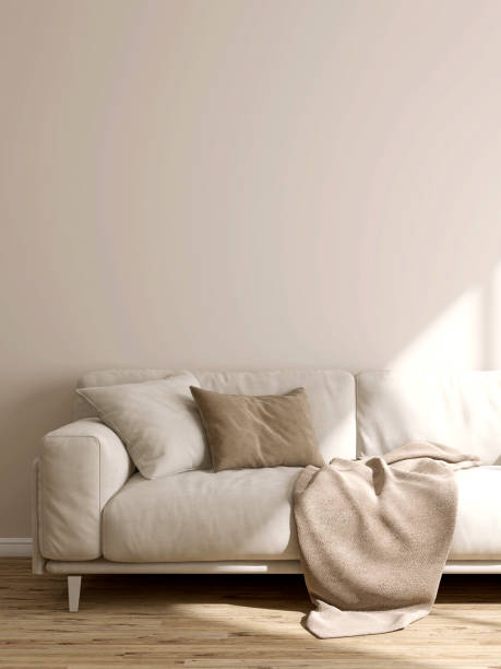 istock Cream comfortable suede leather sofa, brown cushion pillow, blanket in sunlight on blank beige wall, parquet floor 1488812918