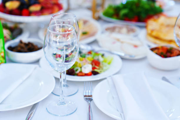istock Two empty glasses on the table served for the holiday. 1488817731