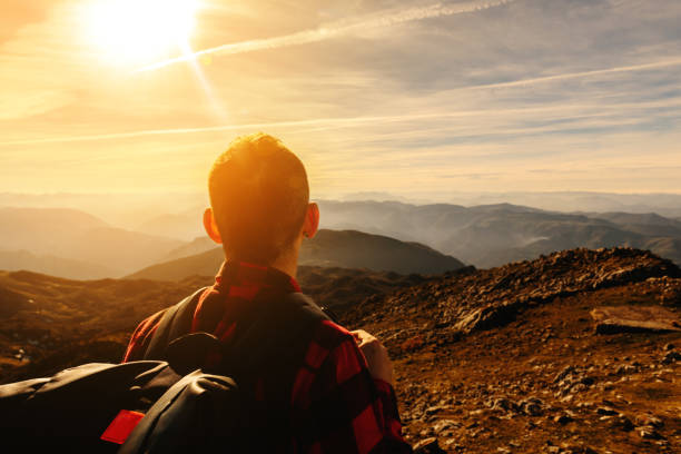 istock man hiking alone in the mountain 1488818063