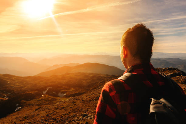istock man hiking alone in the mountain 1488818067