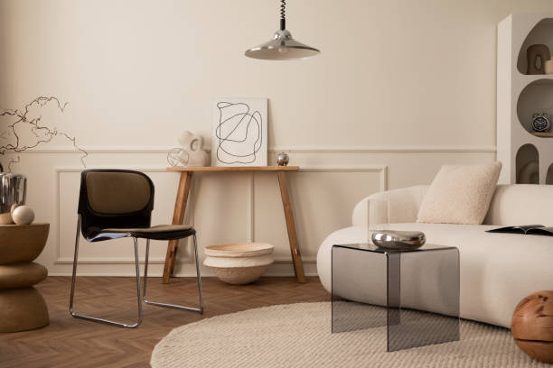 istock Interior design of living room interior with mock up poster frame, modular sofa, chrom bowl, lamp, glass coffee table, wooden bench, stylish rack and personal accessories. Home decor. Template. 1488819364
