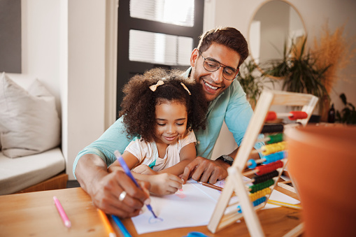 Smile, father or happy girl learning drawing skills, bonding or homeschooling in interracial family house. Proud Indian dad, homework or creative kid writing on paper in child development education