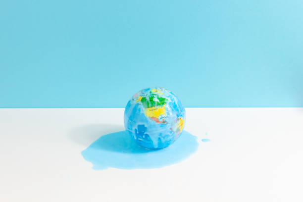 istock Global warming concept with world globe melting on white and blue background 1488820604