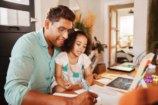 Writing, learning and family father with child in teaching, support and home school or education in numbers. Biracial man or dad helping daughter or kid with math, drawing development or knowledge