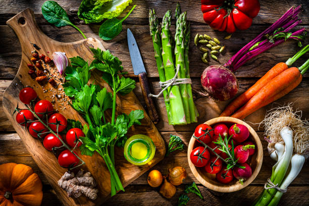 istock Multicolored fresh organic vegetables on wooden table 1488823560