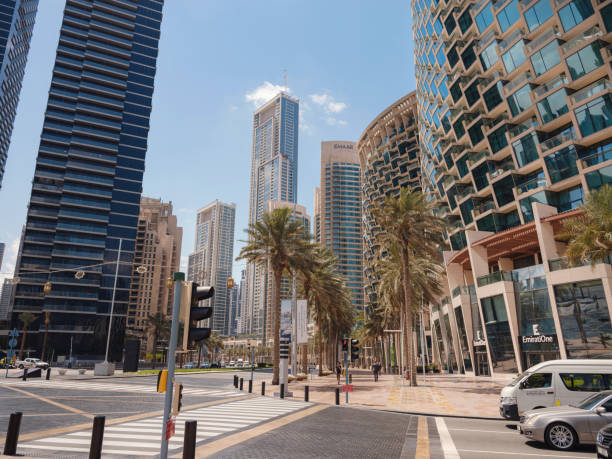 23 March 2023, Dubai, UAE: Downtown Dubai is a crowded area that is popular with tourists. Stylish cafes line Emaar Boulevard. tourist trip to futuristic dubai
