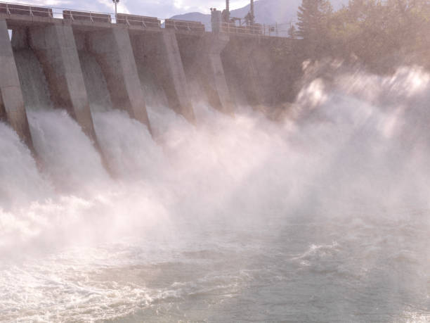 istock Scenic view of hydroelectric facility and distant and mountains 1488829520