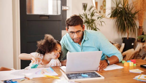 istock Laptop, home education and father with child for e learning support, helping and website information for teaching. Family, dad and girl kid on pc computer for homework, school application or reading 1488833996