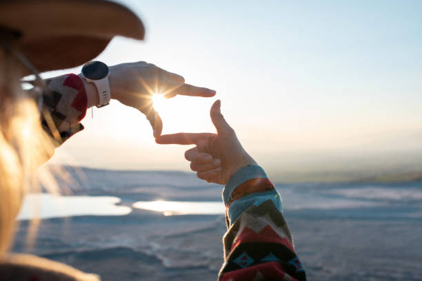 istock Awe-Inspiring Pamukkale: A Tourist's Experience by the Travertine Pools. Making finger frame at sunset near travertine pools in Pamukkale 1488834285