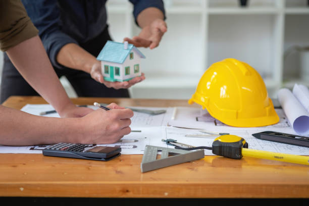 istock Asian engineers brainstorm and measure to document cost estimates and write floor plans for architectural and engineering designs for houses and buildings. 1488834503