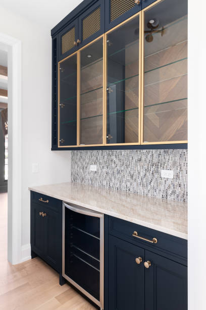 istock A butler's pantry with blue cabinets and a tiled backsplash. 1488837319