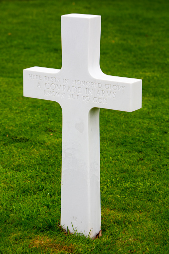 white cross for unknown soldier in spring at american memorial and military cemetery of Margraten in the netherlands