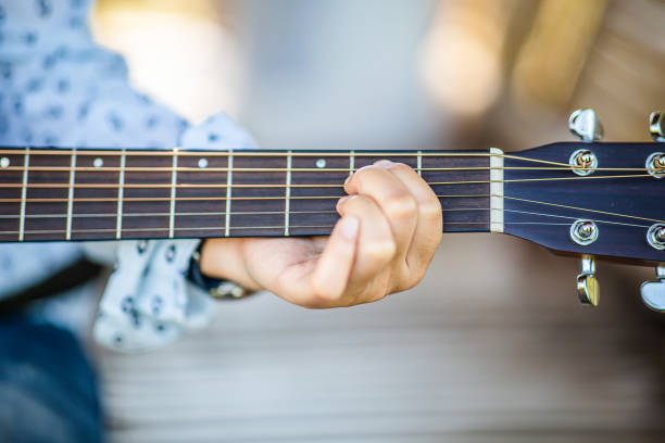 istock Female hand learning to play guitar 1488840494