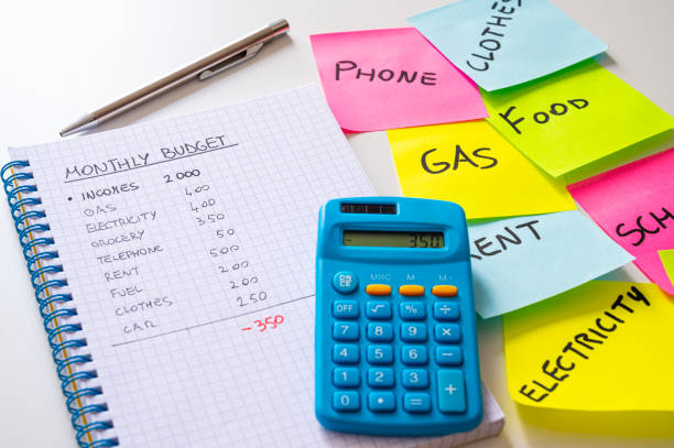 istock Notepad, and alongside adhesive sheets with a list of expenses. 1488842884