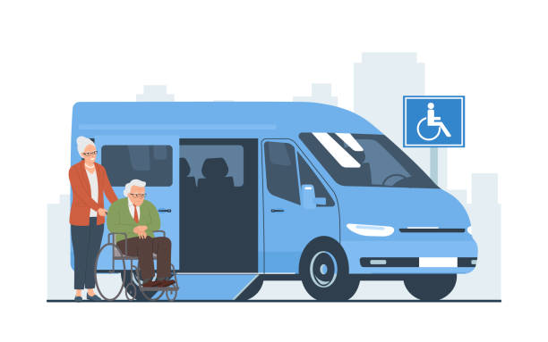 istock An elderly woman pushes an elderly man in a wheelchair into a van. 1488846171