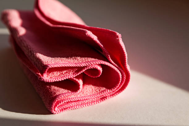 istock a pink nonwoven cloth lying in the windowsill as the sun goes down 1488846530