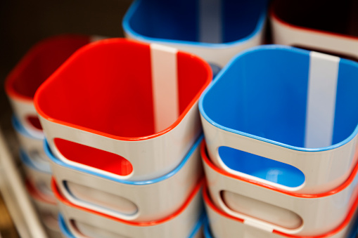 toothbrush mugs stacked in red and blue