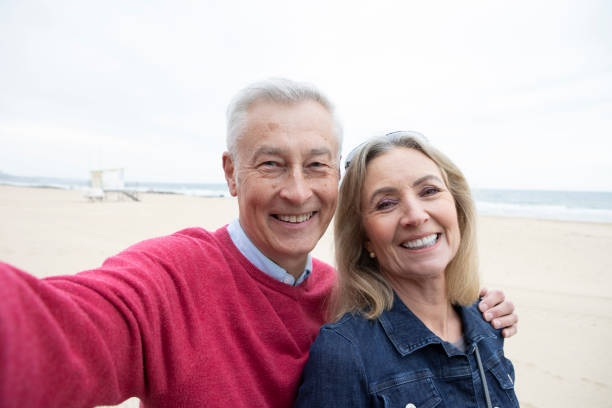 istock Cheerful mature couple taking a selfie photo 1488847687