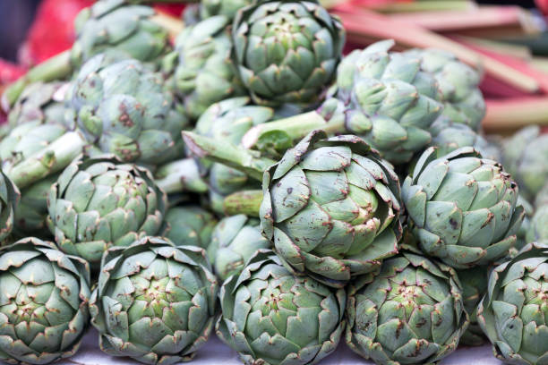 istock Stack of artichokes on a market stall 1488848278