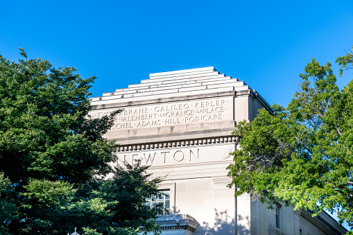 Boston, MA, USA-August 2022; Low angle view of the façade of building 2 of MIT Department of Mathematics with names of mathematicians engraved in facade