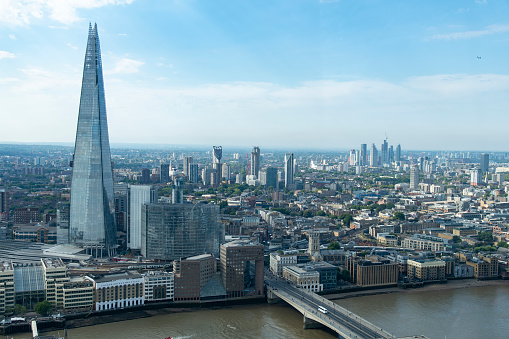 London, England-August 2022; High level panoramic view over South London at London bridge with skyscrapers like The Shard and Strata SE1 at Elephant and Castle in London Borough Southwark