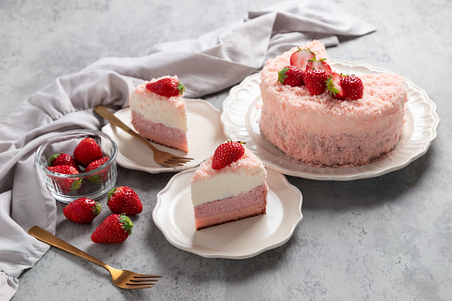 Strawberry double fromage cheesecake on concrete table