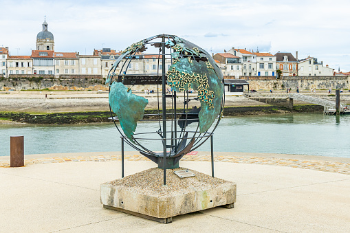 Globe of La Francophonie, a bronze sculpture by Bruce Krebs on Saint Jean d'Acre Square in the Old Port of La Rochelle, France