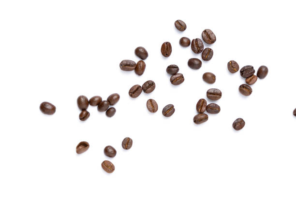 istock Roasted coffee beans pile from top on white background, Coffee beans. Isolated on a white background. 1488853475