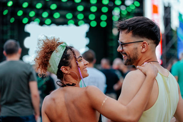 istock Friends bonding at concert 1488855044