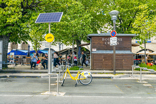 Yélo self-service bicycle station in La Rochelle, France on a summer day