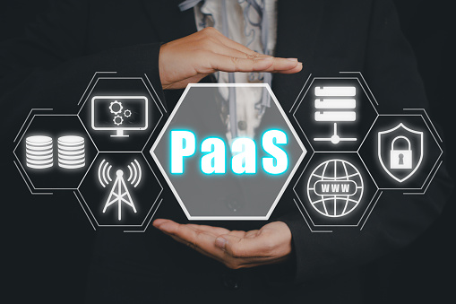 PaaS, Platform as a service, Business person hand holding PaaS icon on VR screen, Internet technology and development concept.