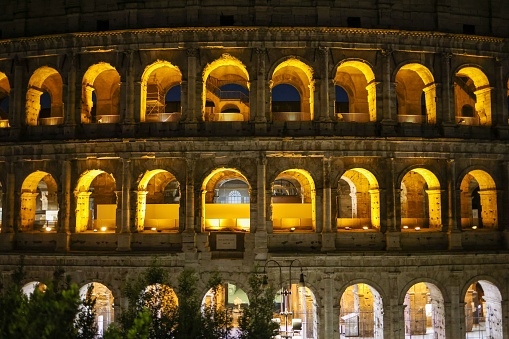 The iconic Coliseum of Rome, Italy illuminated by the lights at night