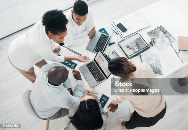 Business People Laptop And Meeting In Planning Above For Web Design Strategy Or Brainstorming At The Office Top View Of Group Designers Working On Computer For Team Project Plan Or Idea On Table Stock Photo - Download Image Now