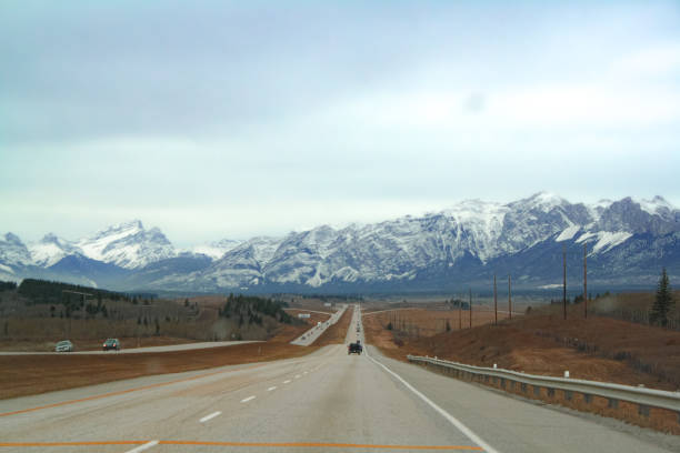 Driving on Trans-Canada Highway (Highway 1) in a autumn sunny day. Banff National Park, Canadian Rockies. Alberta, Canada.
