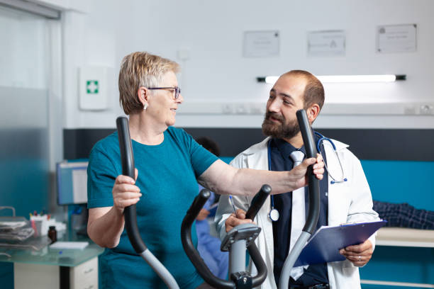 istock Medic talking to senior patient doing physical activity to recover 1488876838